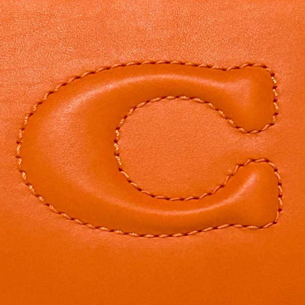 COACH Debossed Sculpted C Smooth Leather Large Corner Zip Wristlet inDark Orange